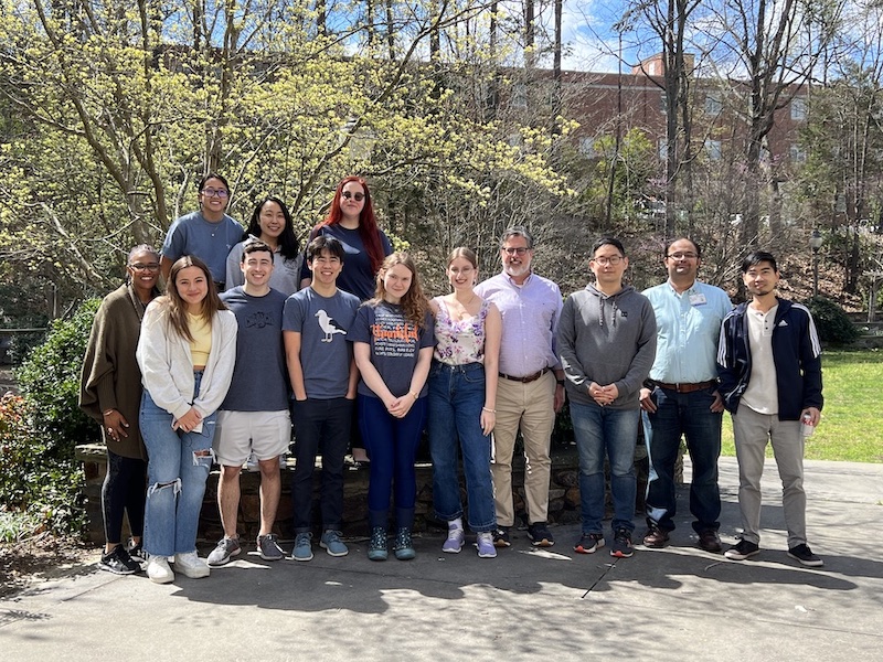 Members of the Floyd Lab celebrating Dr. Floyd's birthday with an outdoor pizza party