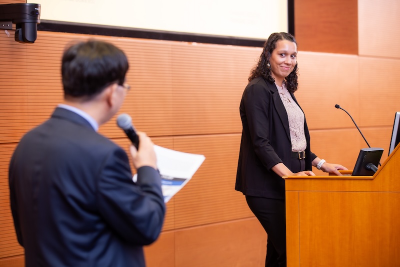 Dr. Howard standing at the podium at the Samulski lecture