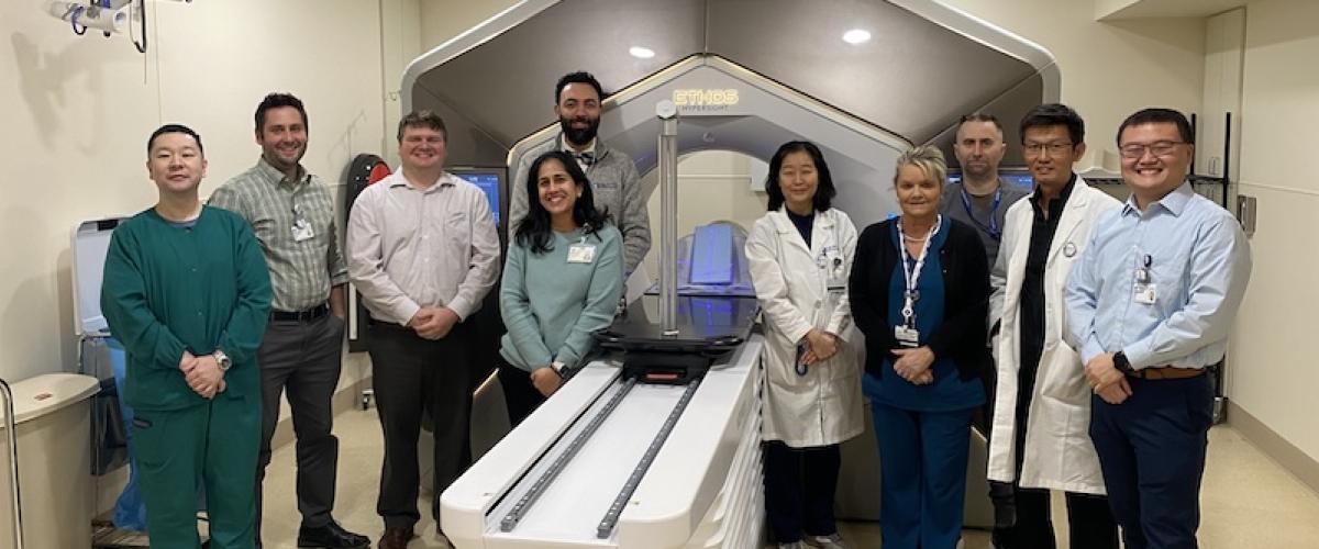 Physicists, dosimetrists and other members of the Ethos team around the machine