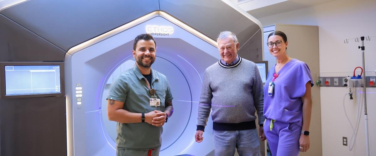 Radiation therapists with a patient