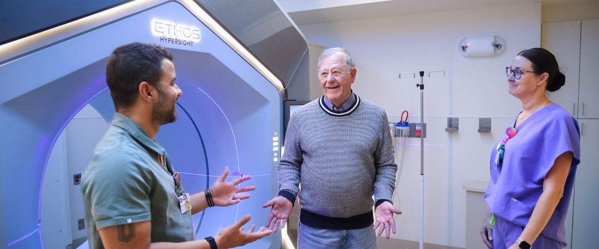 Radiation therapists talking with a patient