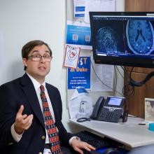 Dr. Vaios with a brain scan